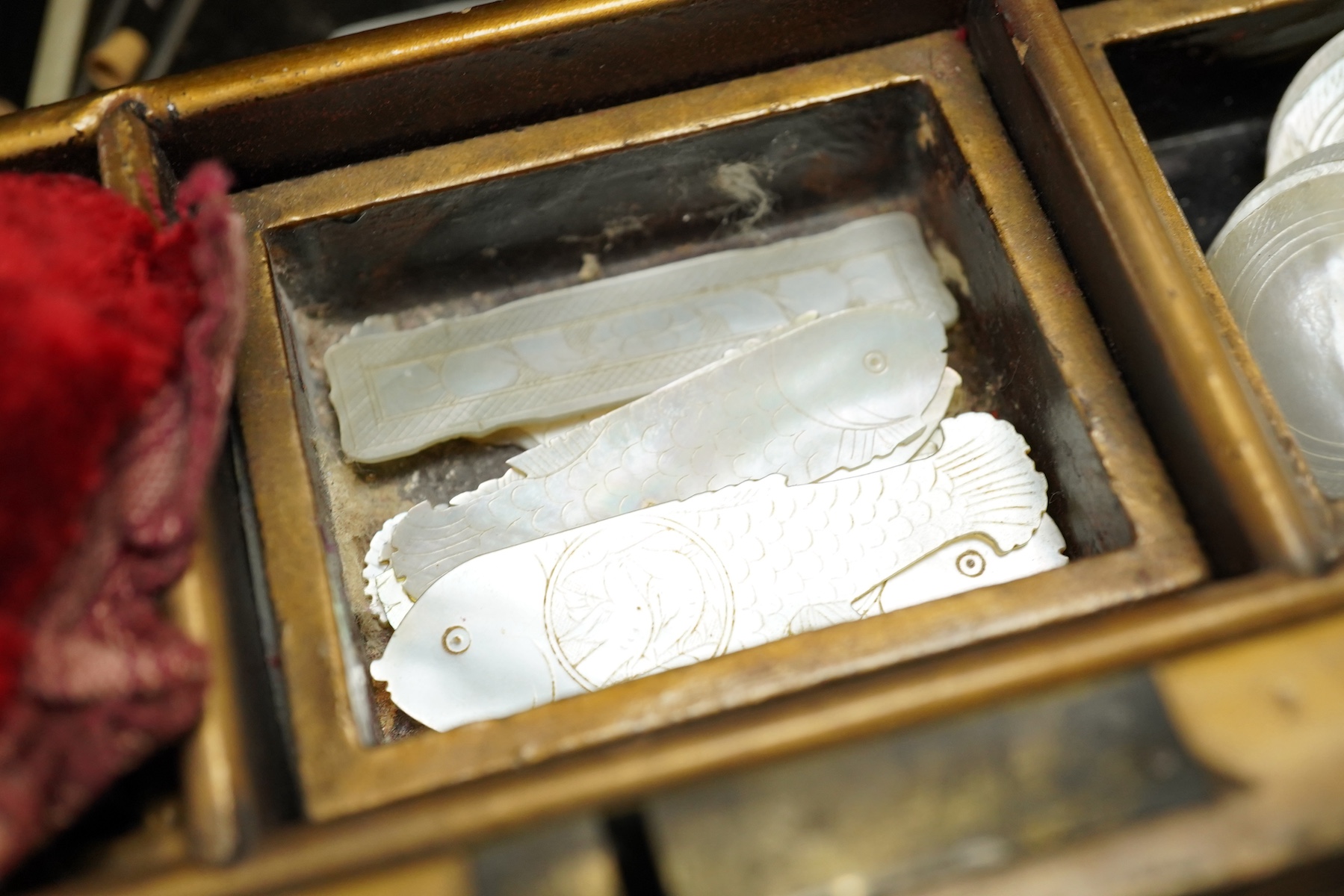 A 19th century Chinese export lacquer box containing assorted mother-of-pearl gaming counters and a 19th century Japanese lacquer box, largest 42.5cm wide. Condition - fair